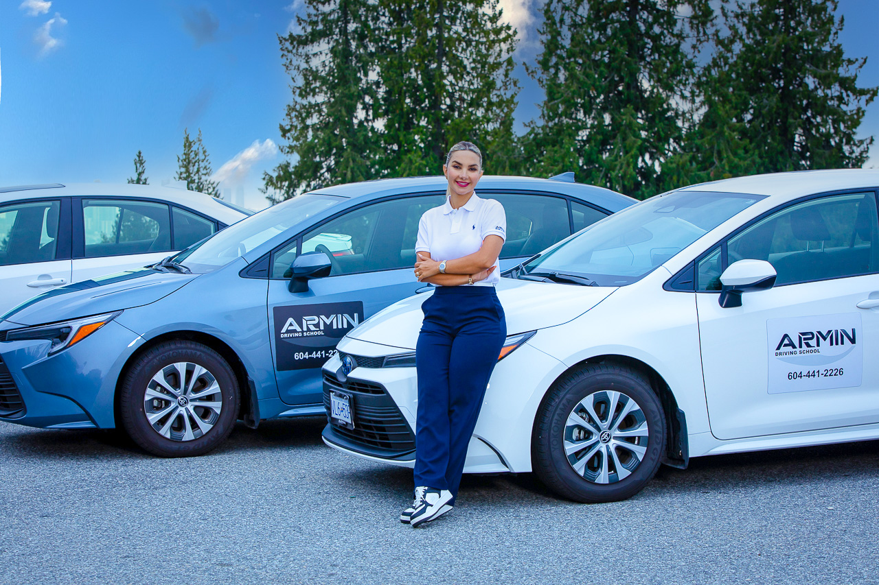 Armin Driving School instructor with training vehicles in Metro Vancouver