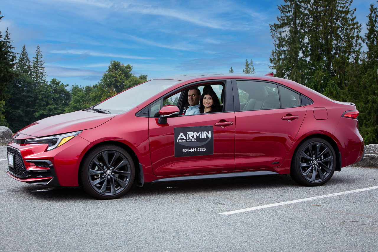 Red Armin Driving School training car in Metro Vancouver
